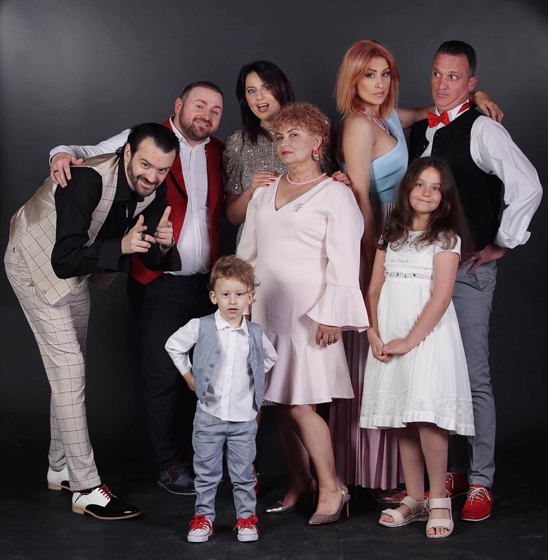 A group of people posing for a photo

Description automatically generated